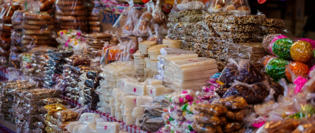 pexels photo 33395013 33395013 Colorful assortment of traditional sweets and candies at a Mexican market stall.